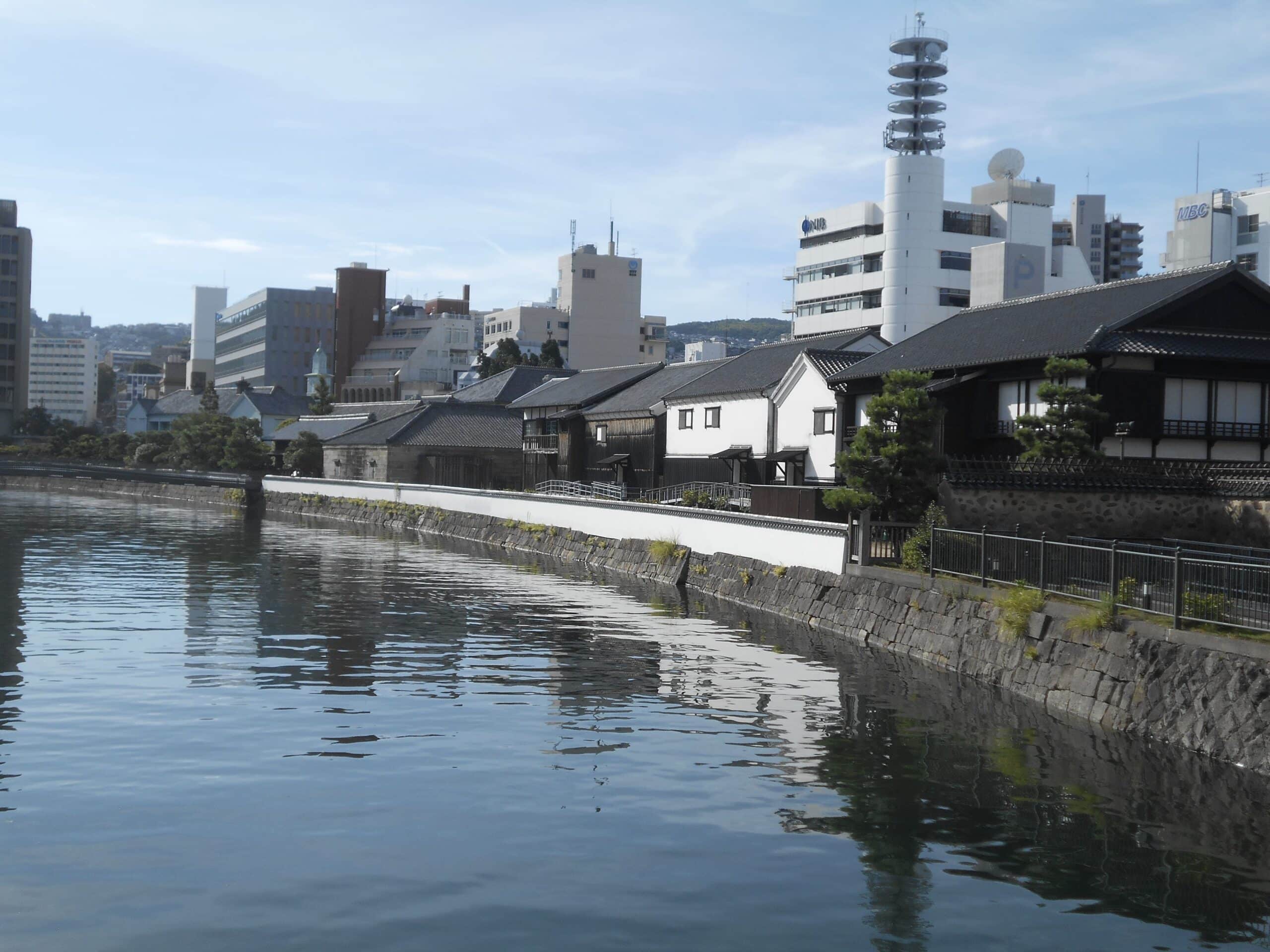 Deshima-in-the-shadow-of-modern-Nagasaki-buildings Chris Joby