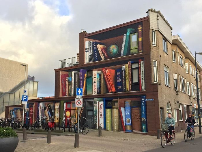 Street art utrecht apartment building transformed into bookcase jan is de man 5cadbde50cee4 700